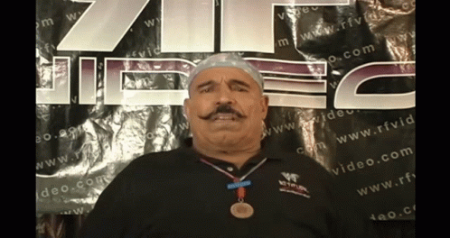 Man with Medal in Front of RFVD Sign