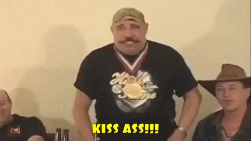 Man With Medal Saying Kiss Ass