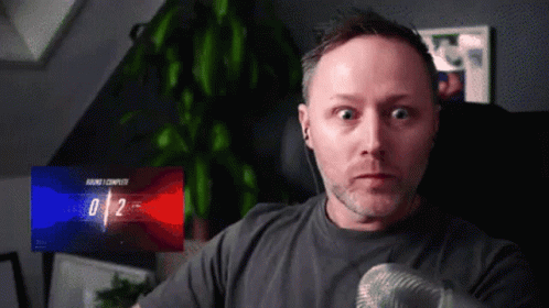Man With Microphone And 0/2 Screen GIF