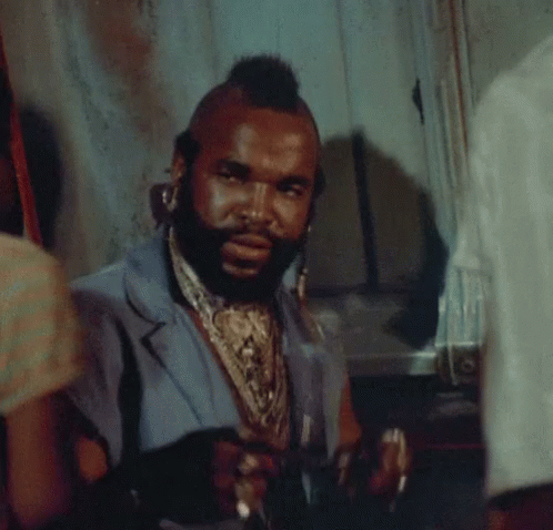Man With Mohawk And Beard In Blue Vest GIF
