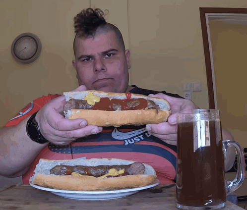Man with Mohawk Eating Hot Dog
