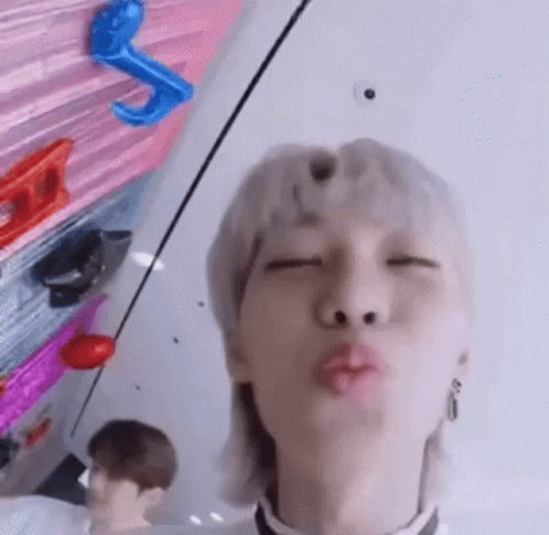 Man With Mullet Blowing a Kiss
