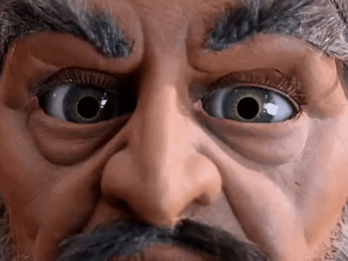 Man With Mustache and Big Blue Eyes
