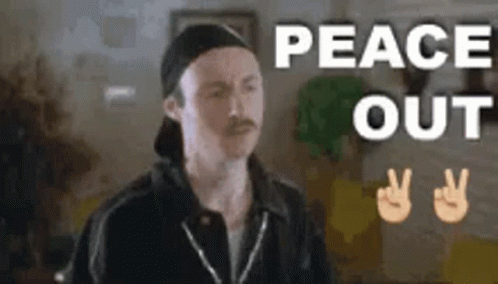 Man with Mustache and Hat Giving Peace Sign