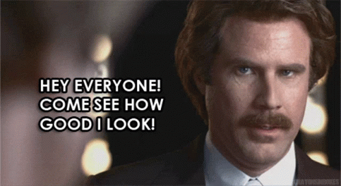 Man with Mustache and Suit Saying Hey