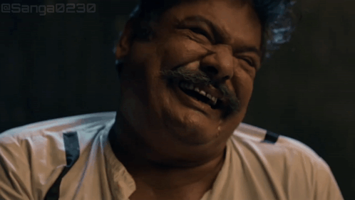 Man with Mustache and Suspenders Laughing
