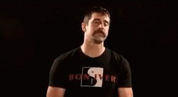 Man With Mustache Blowing Smoke GIF