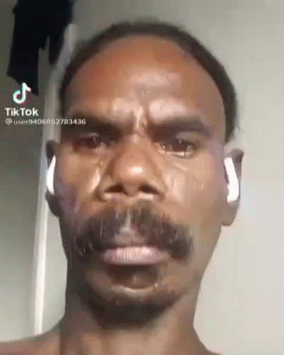 Man With Mustache Crying Wearing Earbuds