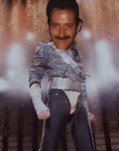 Man With Mustache Dancing on Stage in Costume