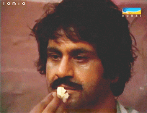 Man with Mustache Eating Popcorn Lamia Dubai