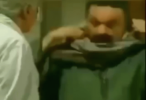 Man with Mustache Examined by Doctor