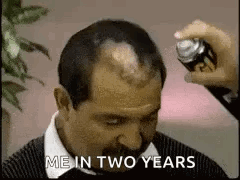 Man With Mustache Getting Hair Sprayed GIF