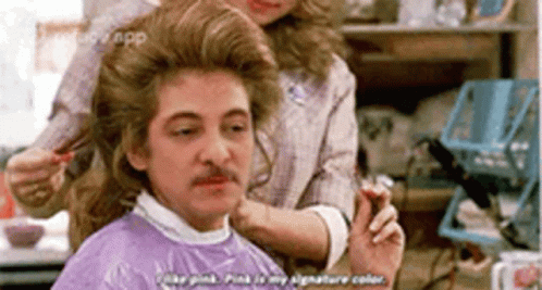 Man With Mustache Getting Haircut by Woman in Salon