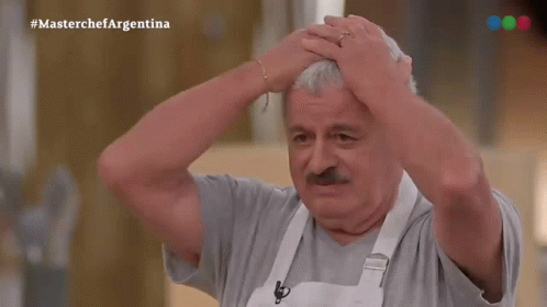 Man With Mustache Holding Head in Front of MasterChef Argentina Logo