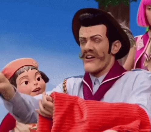 Man With Mustache Holding Red Blanket Next to Cartoon Character