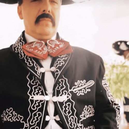 Man with Mustache in Black Embroidered Jacket