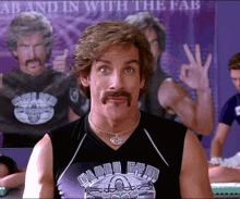 Man with Mustache in Black Tank Top Saying Ab and In with the Fab