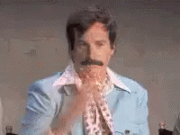 Man With Mustache in Blue Jacket and Scarf