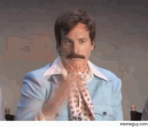 Man with Mustache in Blue Jacket and Scarf