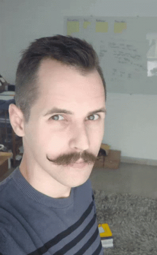 Man with Mustache in Blue Striped Shirt