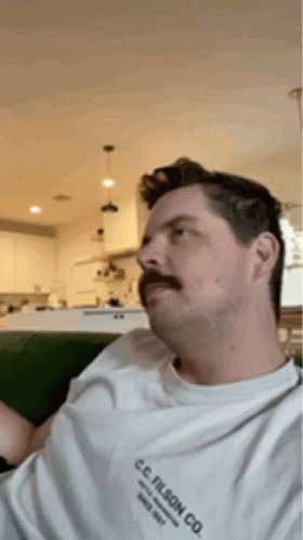 Man With Mustache In C.C. Filson Co. Shirt GIF