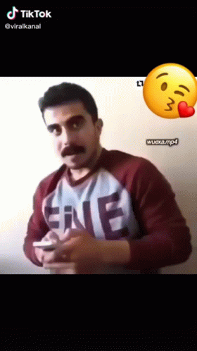 Man with Mustache in EME Shirt