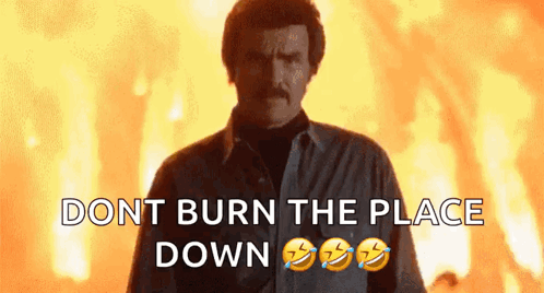 Man with Mustache in Front of Fire