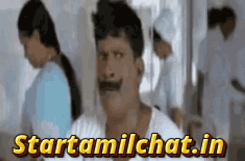 Man with Mustache in Front of Startamilchat.in Sign