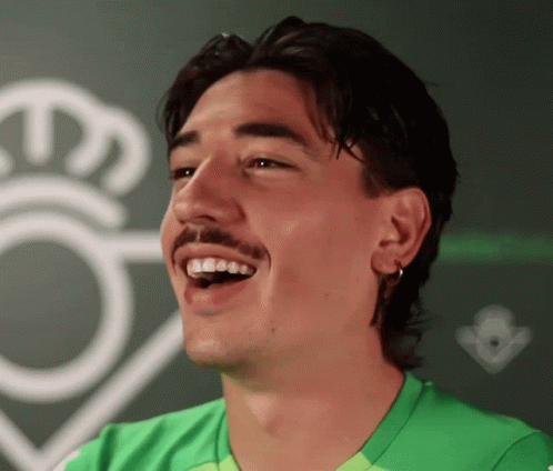 Man With Mustache in Green Shirt Smiling