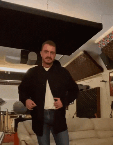 Man with Mustache in Living Room