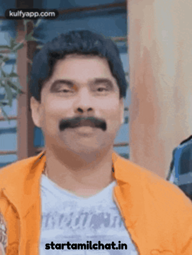 Man With Mustache In Orange Jacket Saying Starttamilchat.in GIF