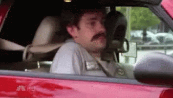 Man With Mustache In Red Car GIF