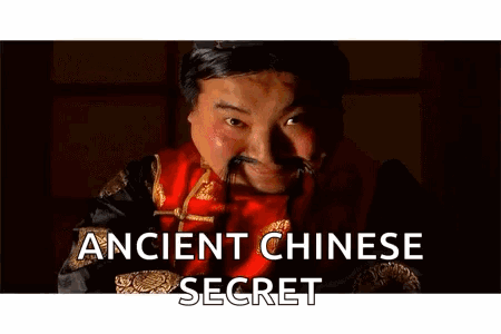 Man With Mustache in Red Robe Saying Ancient Chinese Secret