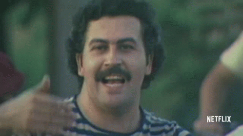 Man with Mustache in Striped Shirt and Red Hat Smiling