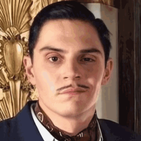 Man With Mustache in Suit and Tie Making Face