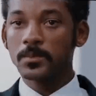 Man With Mustache in Suit and Tie Making Funny Face