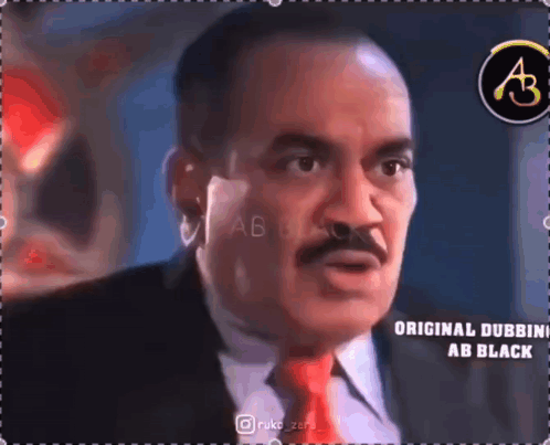 Man With Mustache in Suit and Tie Talking to Someone