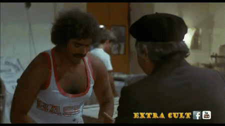Man With Mustache In Tank Top Saying Bas GIF