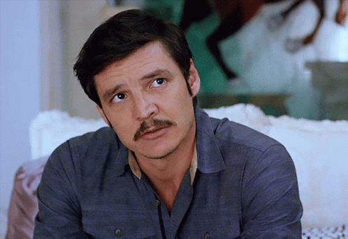 Man With Mustache in White Shirt by Window