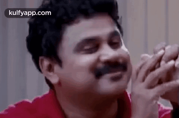 Man With Mustache Laughing Covering Face