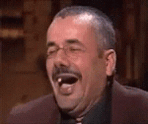 Man With Mustache Laughing With Tongue Out