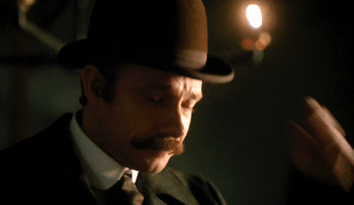 Man with Mustache Looking at Camera
