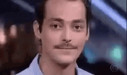 Man with Mustache Looking at Camera