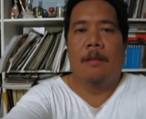 Man with Mustache Looking at Camera