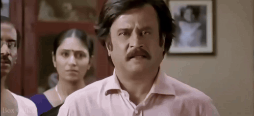 Man With Mustache Making Funny Face Before Group GIF