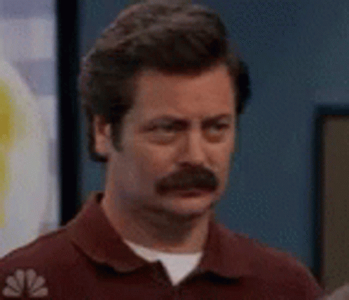 Man with Mustache Making Funny Face in Red Shirt