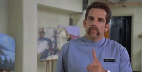 Man with Mustache Making Shhh Gesture