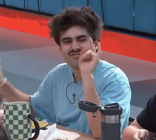Man with Mustache Sitting at Table