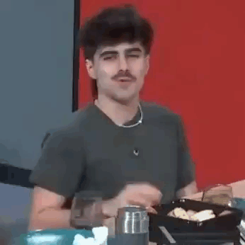 Man with Mustache Sitting at Table