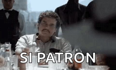 Man with Mustache Sitting at Table